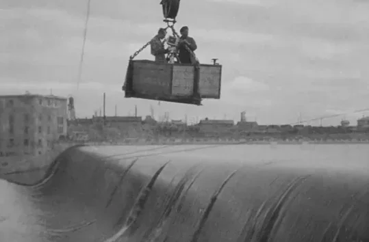 The cameraman “flying” over the dam in Man with a Movie Camera